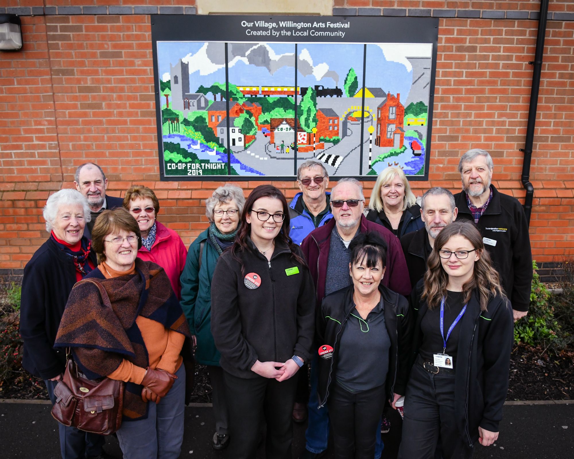 Willington food store emblazoned with colourful community artwork celebrating village life
